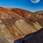 moon-rise-over-rainbow-mountains-featured
