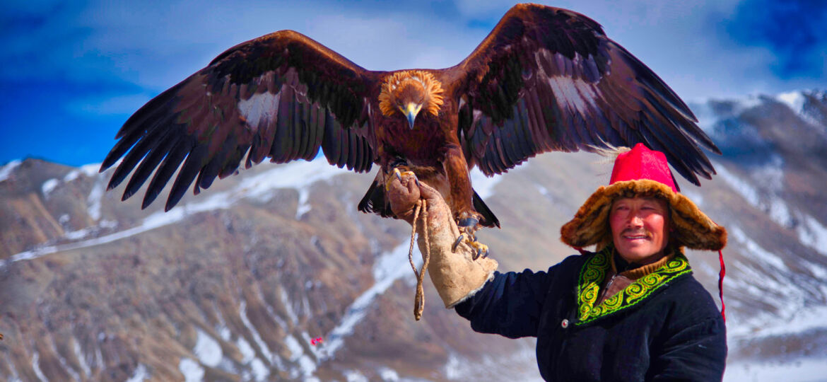 One of the eagle hunters displaying the beauty of his eagle as he prepares for the competition as best hunter